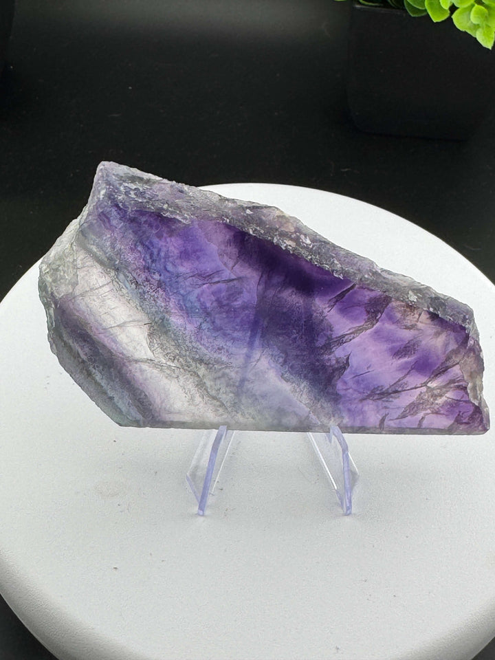 Beautiful mix of Rainbow Fluorite slabs from China. Wonderful mix of purples, blues, teals, and other colors in between! Some pieces have natural crack line formations. Some slabs have a varying thickness, as specified below. A) 4in x 2.5in x 9mm B) 3.25i