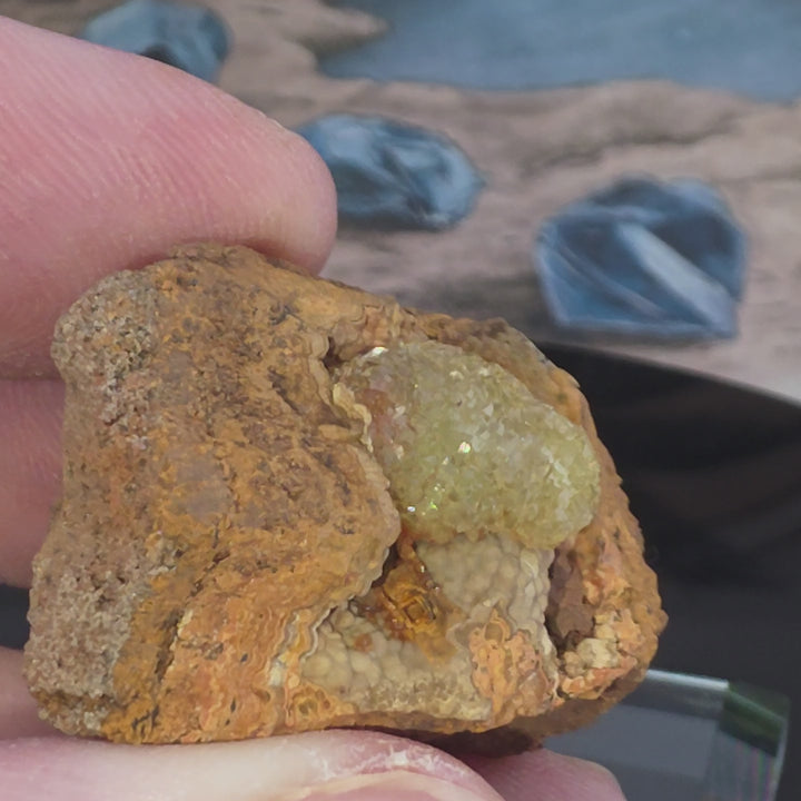 Vibrant Adamite Specimen from Ojuéla Mine exhibiting glowing green crystal formations.