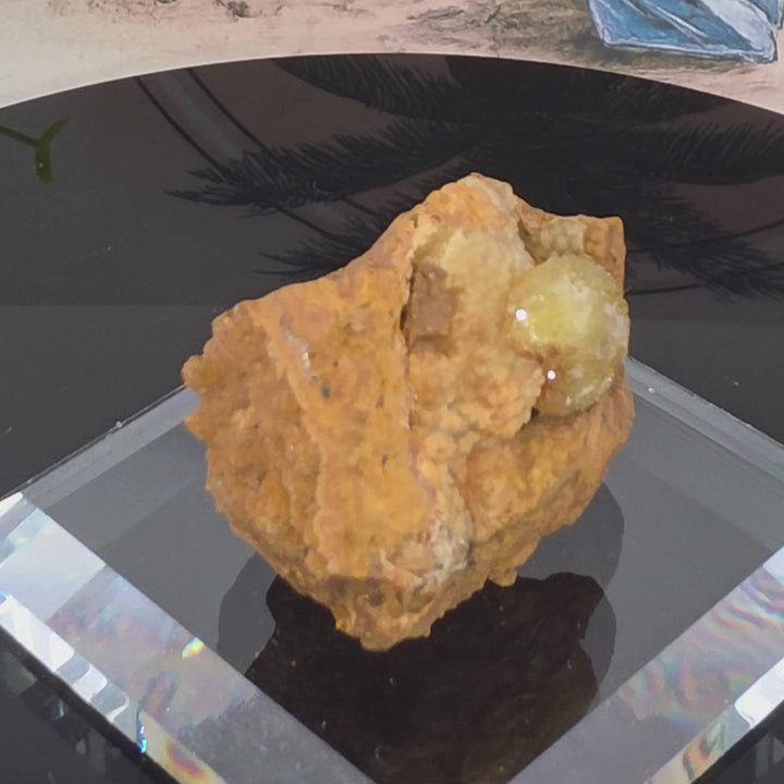 Vibrant Adamite Specimen from Ojuéla Mine exhibiting glowing green crystal formations.