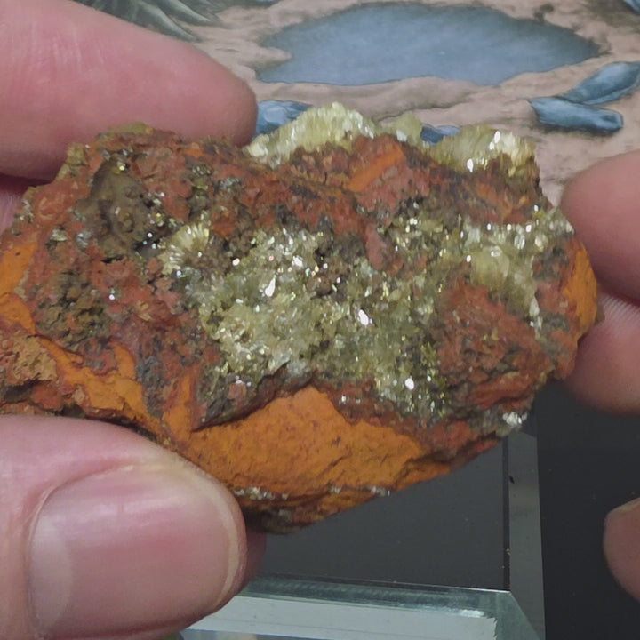 Vibrant Adamite Specimen from Ojuéla Mine exhibiting glowing green crystal formations.