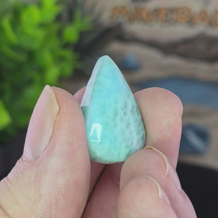 Dive into the tranquil beauty of our Larimar Cabochons. Sourced from the Dominican Republic, these rare and captivating gemstones showcase stunning shades of oceanic blues and whites, reminiscent of Caribbean waters. Each beautifully polished cabochon pai