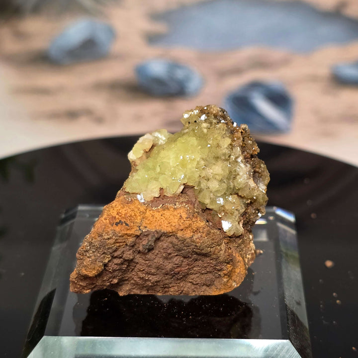 Vibrant Adamite Specimen from Ojuéla Mine exhibiting glowing green crystal formations.