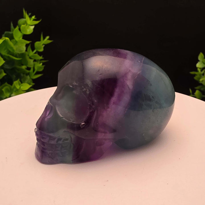Rainbow Fluorite skull carving - 2.5 Inch; showcasing purple and blue hues, stunning details, and intricate craftsmanship.