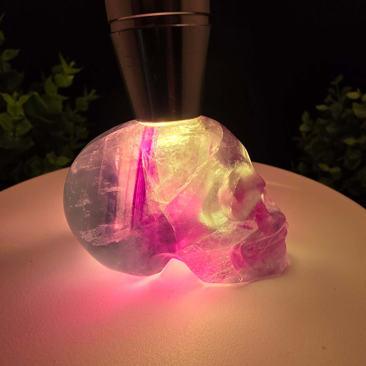 Rainbow Fluorite skull carving - 2.5 Inch; showcasing purple and blue hues, stunning details, and intricate craftsmanship.