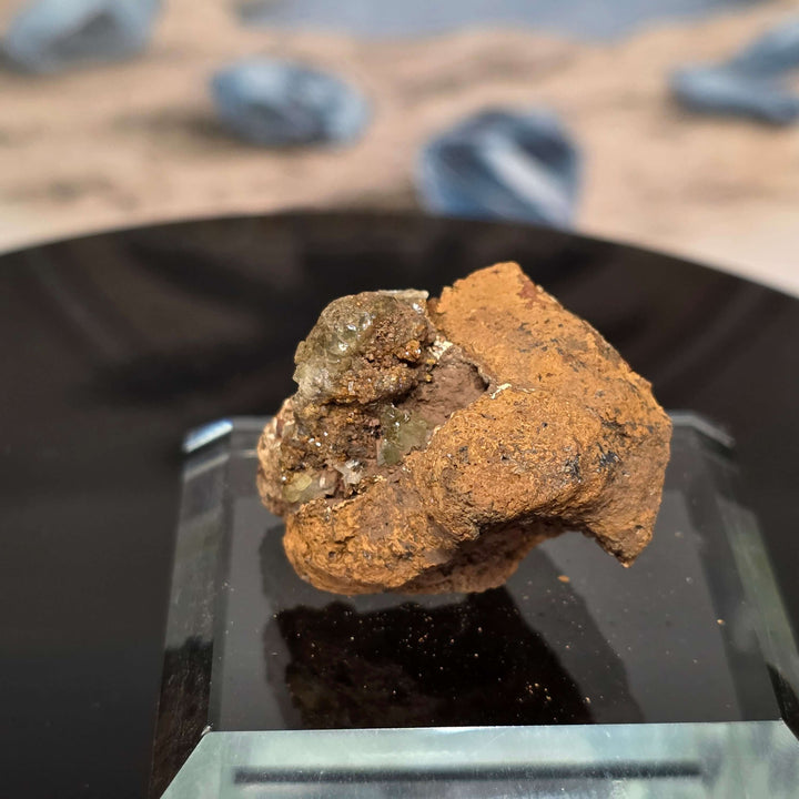 Vibrant Adamite Specimen from Ojuéla Mine exhibiting glowing green crystal formations.