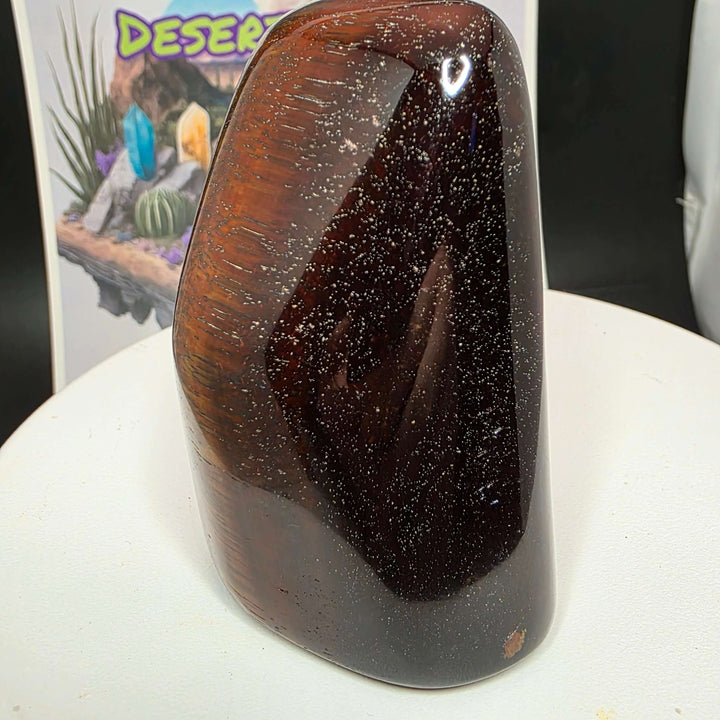 Polished Red Tiger's Eye freeform showcasing rich reddish-brown colors and sparkles, perfect for collectors.