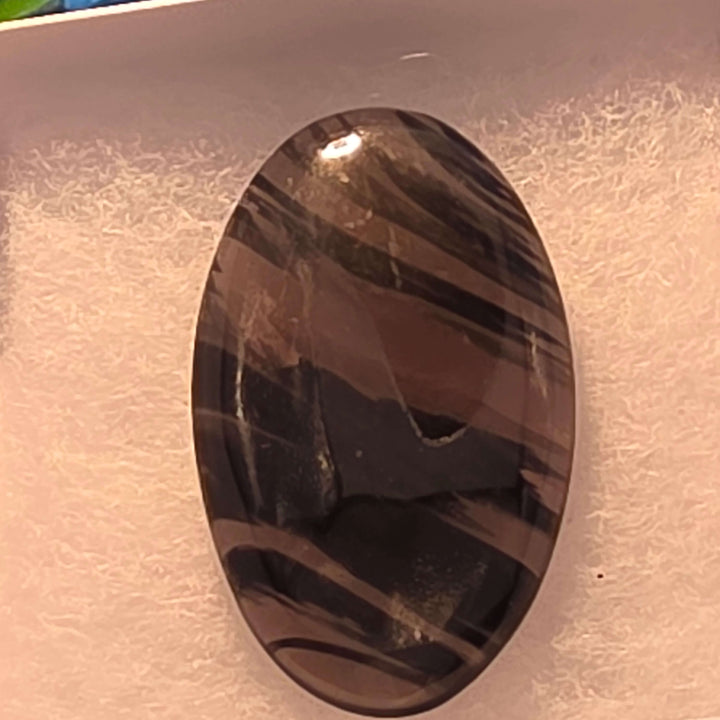 Unveil the captivating depths of our Midnight Lace Obsidian Cabochons These exquisitely polished cabochons feature the distinctive subtle banding and intricate patterns unique to Midnight Lace Obsidian, reminiscent of a moonlit night sky. Each pair is ele