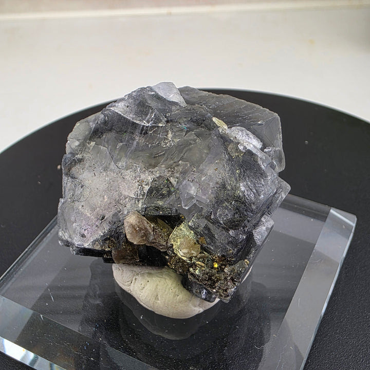 Fluorite Specimen - Yaogangxian Mine China showcasing intergrown crystals with sharp edges and notable color zoning.