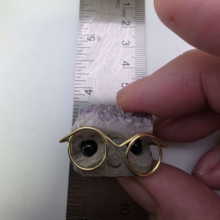 Crystal Buddies - Specimen Carvings with glasses and a purple crystal, showcasing their adorable personality.