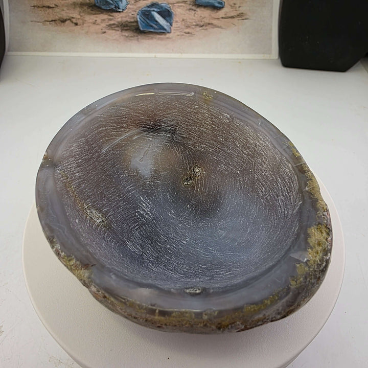 Hand carved Agate Bowl showcasing a smooth interior and rugged exterior, perfect for functional art display.