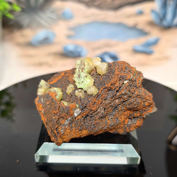 Vibrant Adamite Specimen from Ojuéla Mine exhibiting glowing green crystal formations.