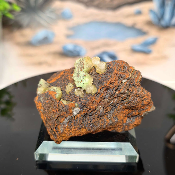 Vibrant Adamite Specimen from Ojuéla Mine exhibiting glowing green crystal formations.