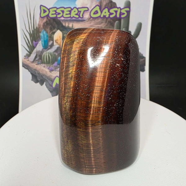 Polished Red Tiger's Eye freeform showcasing distinct reddish-brown colors, ideal for decoration or crystal healing.