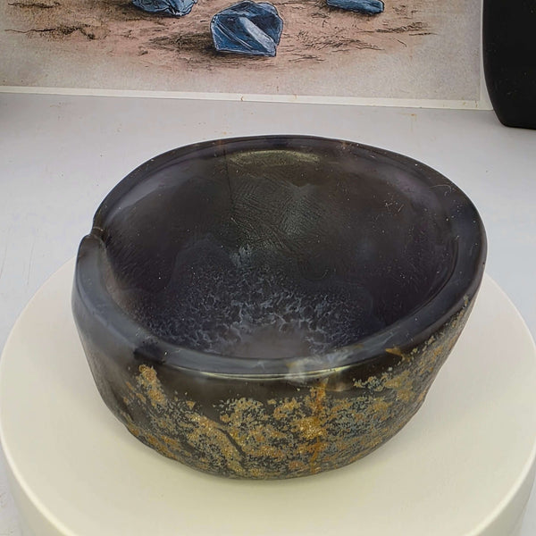 Hand carved Agate Bowl showcasing a smooth interior and rugged exterior, perfect for functional art display.
