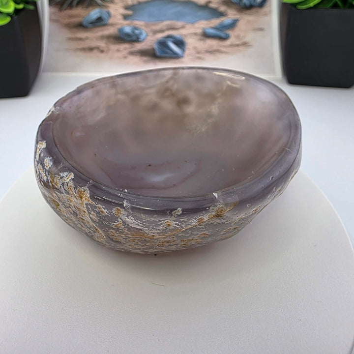 Hand carved Agate Bowl showcasing a smooth interior and rugged exterior, perfect for functional art display.