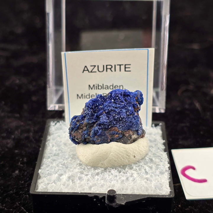 We're thrilled to offer a new selection of Azurite specimens, each mounted within an acrylic "Perky" display box for optimal protection and viewing. These exceptional pieces originate from the renowned Mibladen mining district in Morocco, an area well-kno
