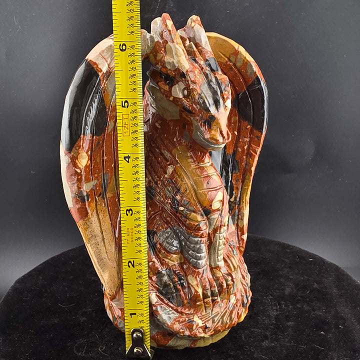 Jasper Sitting Dragon Carving, detailed sculpture in warm reds and blacks, over six inches tall.