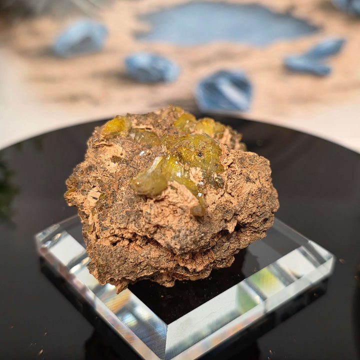 Vibrant Adamite Specimen from Ojuéla Mine exhibiting glowing green crystal formations.