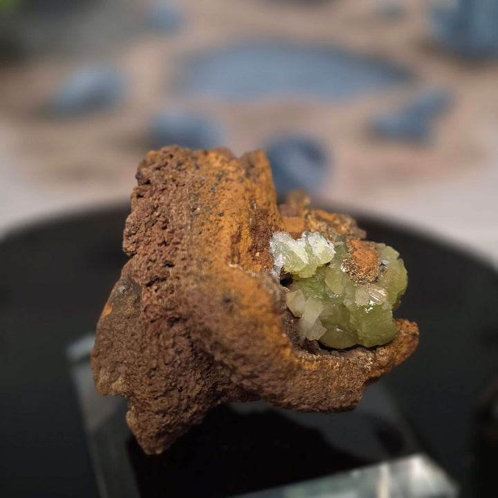 Vibrant Adamite Specimen from Ojuéla Mine exhibiting glowing green crystal formations.