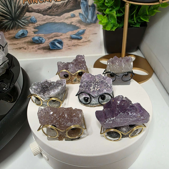 Crystal Buddies - Specimen Carvings displayed with glasses, showcasing adorable crystal hedgehogs and their unique personalities.