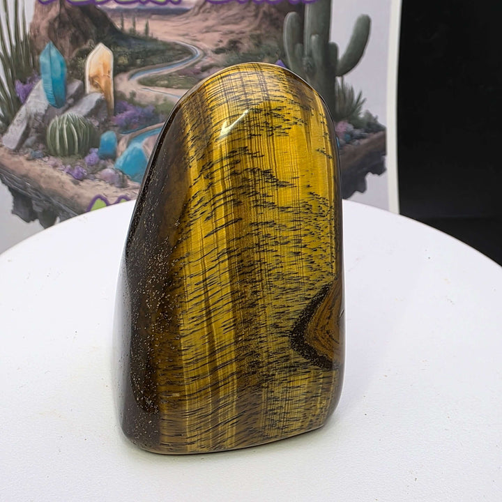 Polished Tiger's Eye freeform showcasing stunning golden color and chatoyancy, with smooth surface and natural patterns.