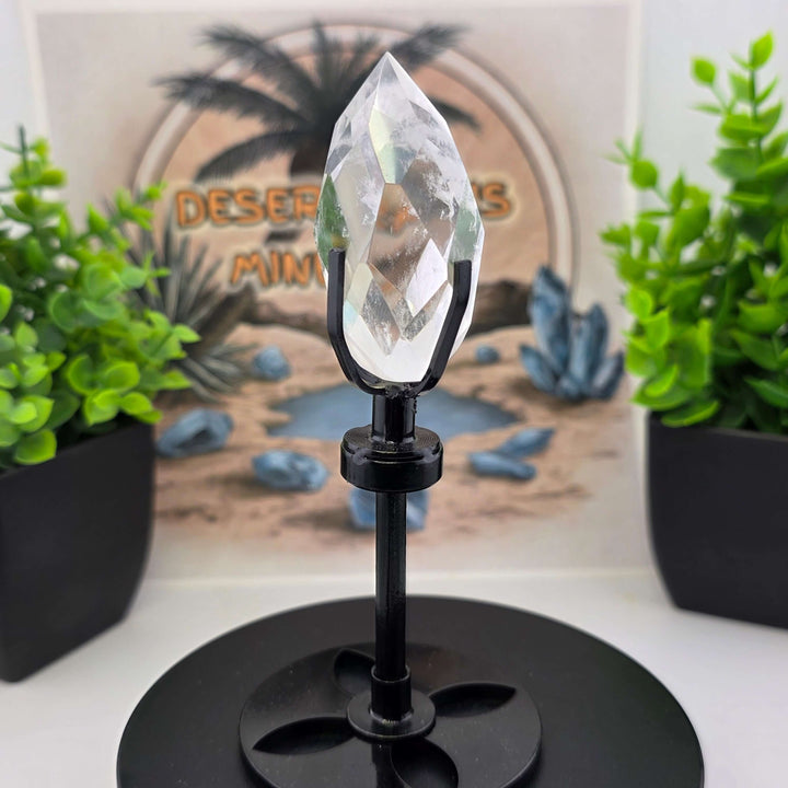 Polished Faceted Clear Quartz Crystal Tear Drop with Stand showcasing clarity and elegance on custom metal stand.