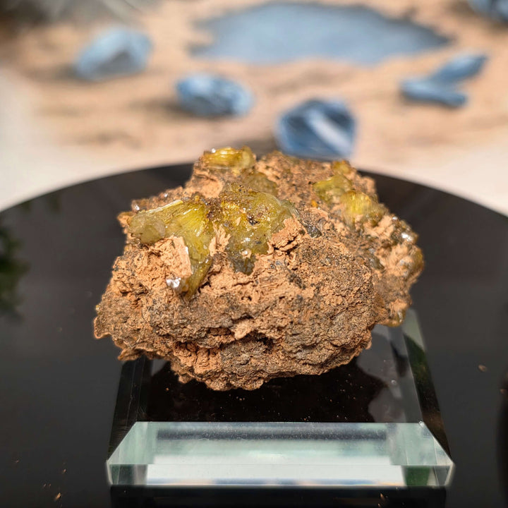 Vibrant Adamite Specimen from Ojuéla Mine exhibiting glowing green crystal formations.