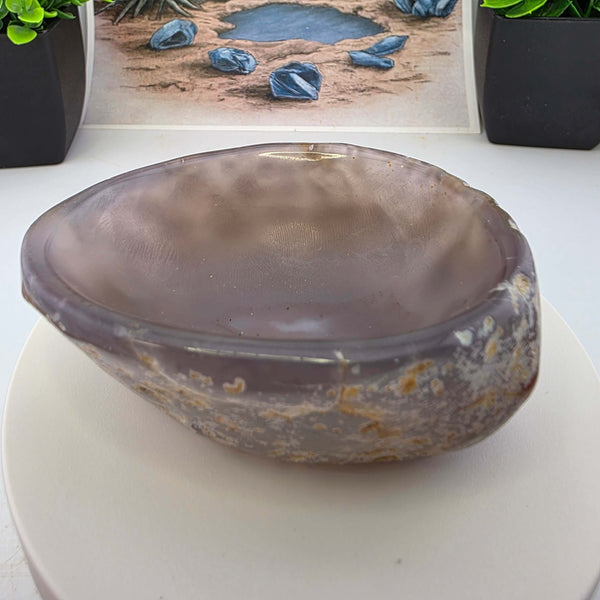 Hand carved Agate Bowl showcasing a smooth interior and rugged exterior, perfect for functional art display.