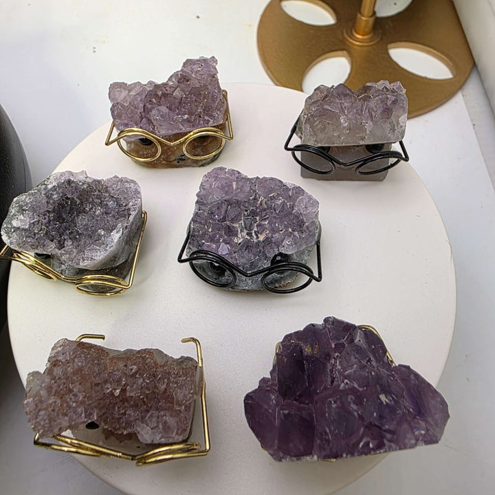 Crystal Buddies - Specimen Carvings featuring unique crystal hedgehogs wearing glasses on a display.