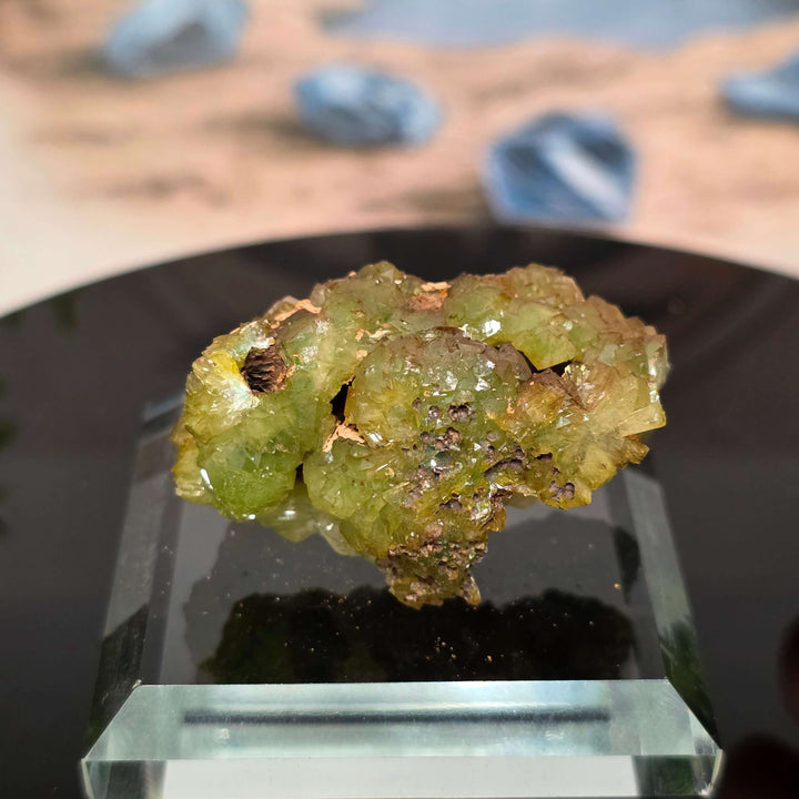 Vibrant Adamite Specimen from Ojuéla Mine exhibiting glowing green crystal formations.