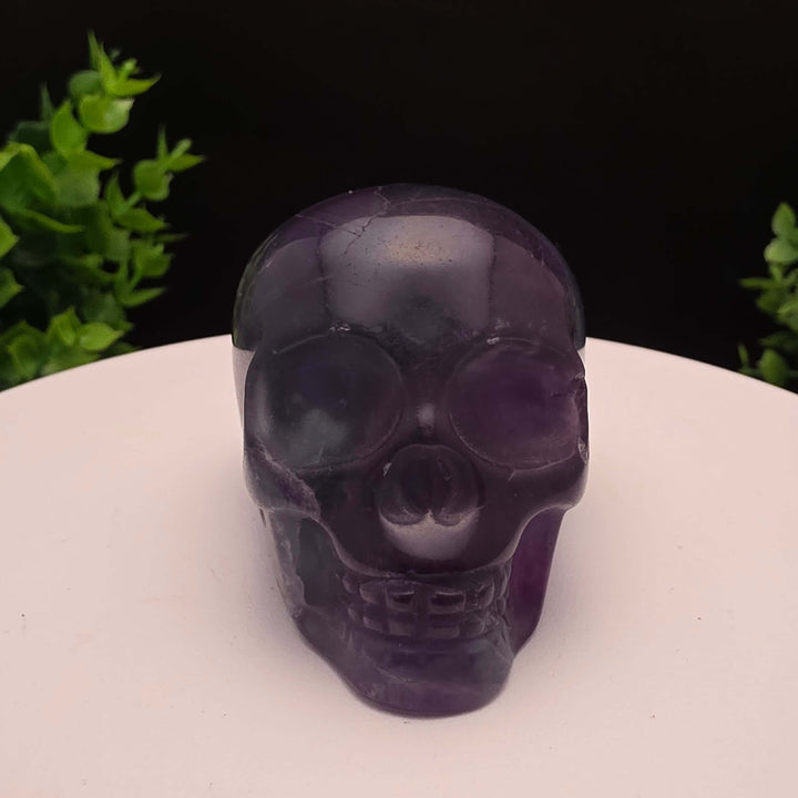 Rainbow Fluorite skull carving - 2.5 Inch; showcasing purple and blue hues, stunning details, and intricate craftsmanship.