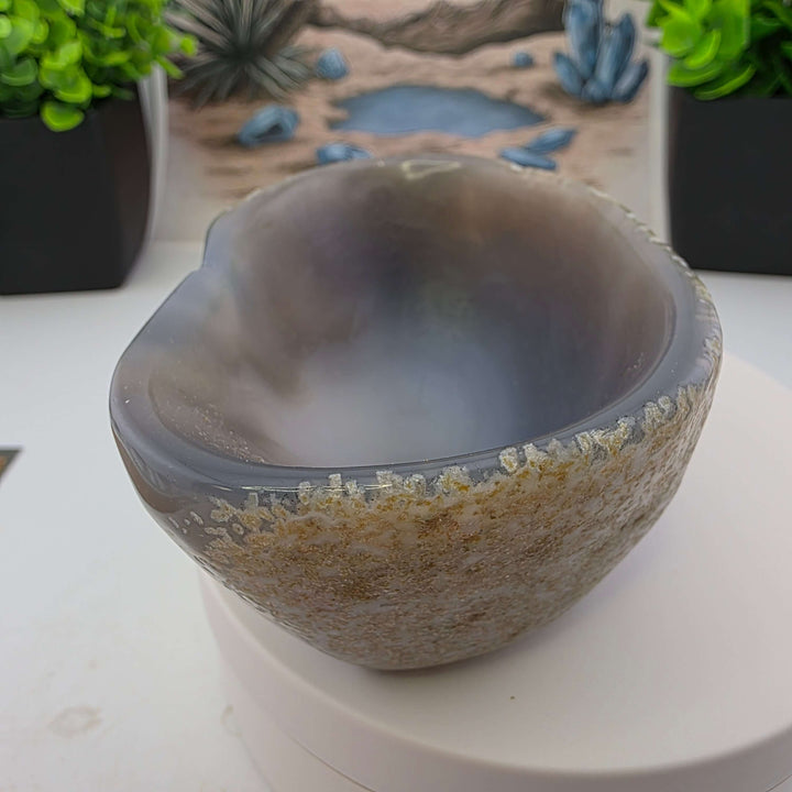 Hand carved Agate Bowl showcasing a smooth interior and rugged exterior, perfect for functional art display.