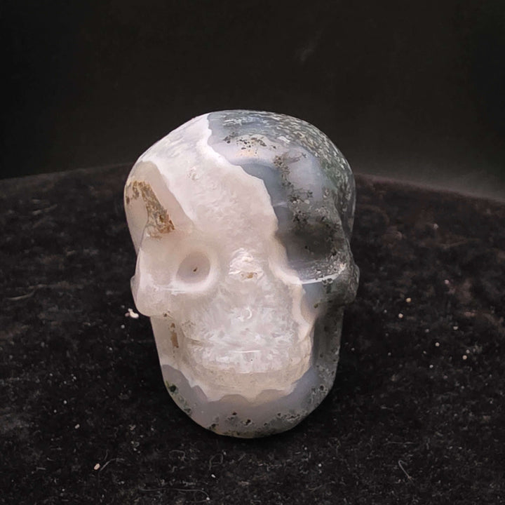 Moss Agate Skull Carving - 2 inch featuring unique blue-green inclusions and milky Quartz for a painterly appearance.