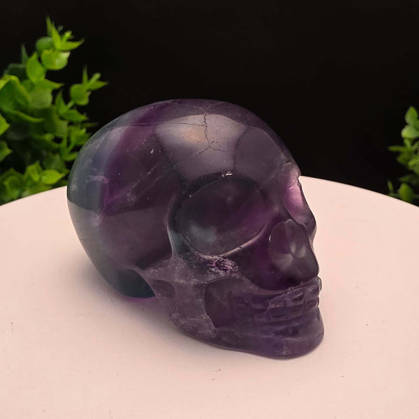 Rainbow Fluorite skull carving - 2.5 Inch; showcasing purple and blue hues, stunning details, and intricate craftsmanship.