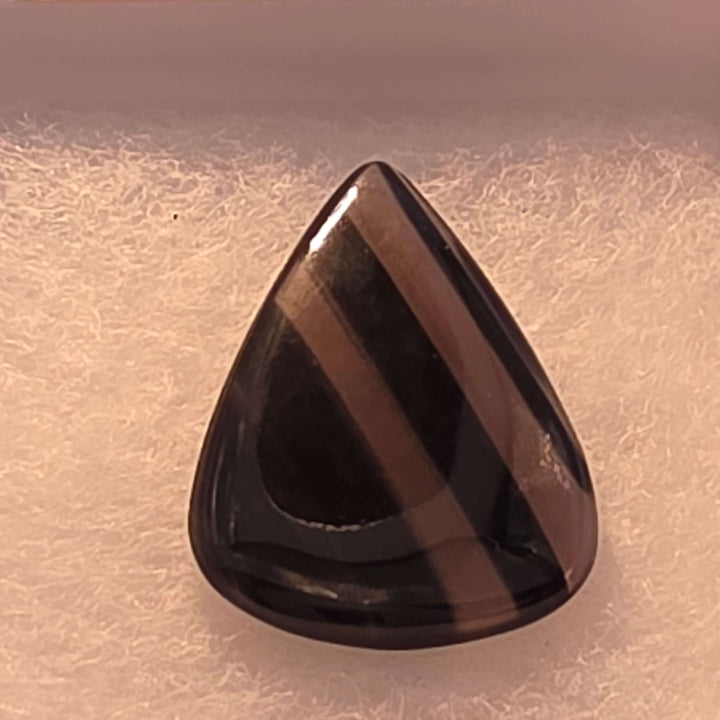 Unveil the captivating depths of our Midnight Lace Obsidian Cabochons These exquisitely polished cabochons feature the distinctive subtle banding and intricate patterns unique to Midnight Lace Obsidian, reminiscent of a moonlit night sky. Each pair is ele