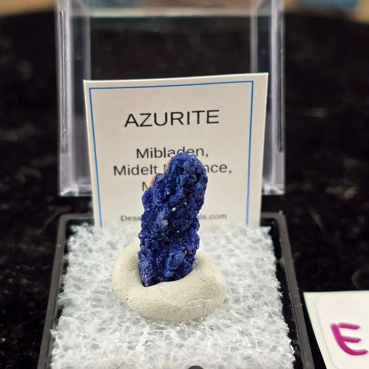 We're thrilled to offer a new selection of Azurite specimens, each mounted within an acrylic "Perky" display box for optimal protection and viewing. These exceptional pieces originate from the renowned Mibladen mining district in Morocco, an area well-kno