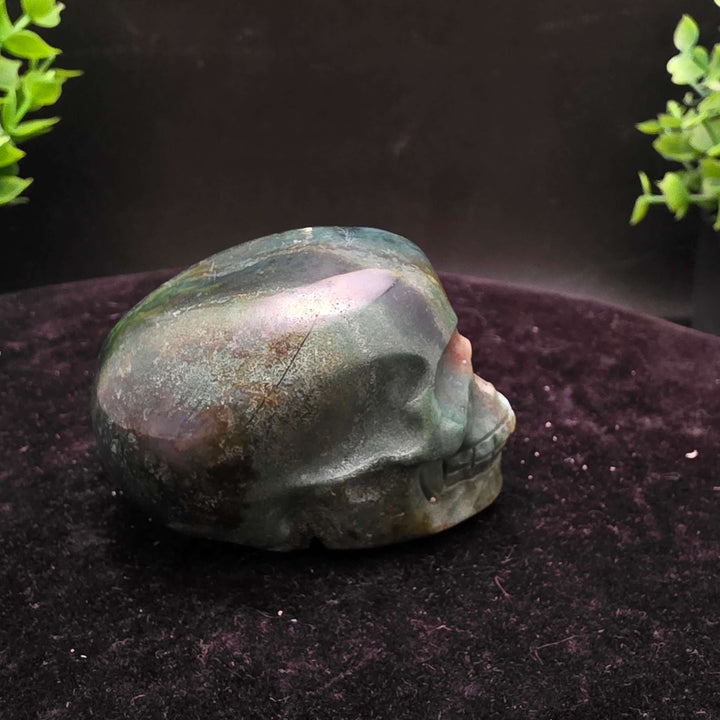  Orbicular Jasper Skull Carving - 2.25 Inch showcasing unique colors and textures on a dark background.