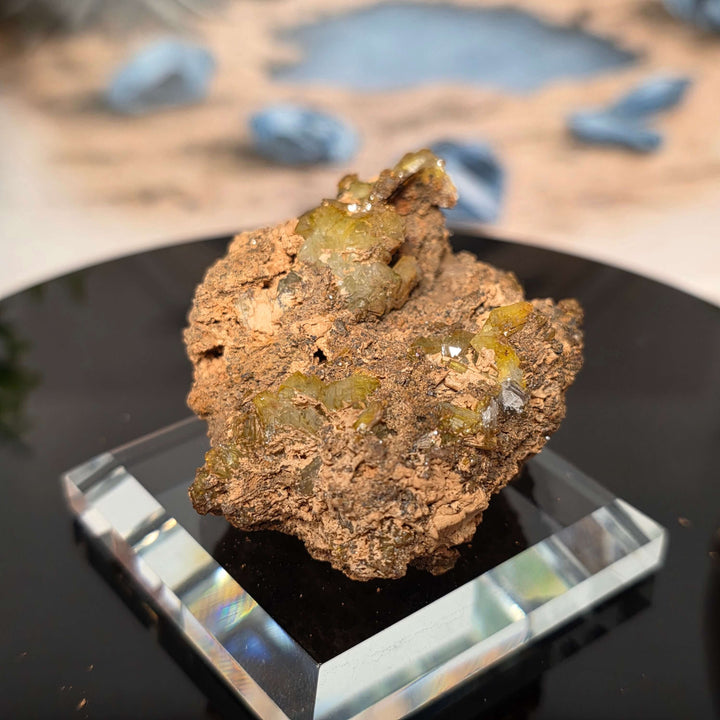 Vibrant Adamite Specimen from Ojuéla Mine exhibiting glowing green crystal formations.