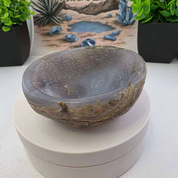Hand carved Agate Bowl showcasing a smooth interior and rugged exterior, perfect for functional art display.