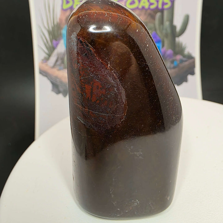 Polished Red Tiger's Eye freeform showcasing rich reddish-brown hues and unique natural patterns.