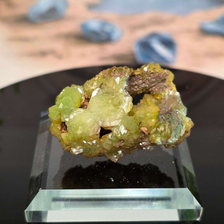 Vibrant Adamite Specimen from Ojuéla Mine exhibiting glowing green crystal formations.