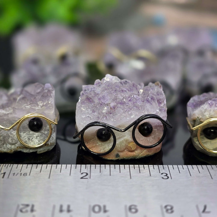 Crystal Buddies - Specimen Carvings featuring cute crystal hedgehogs with glasses over amethyst clusters.