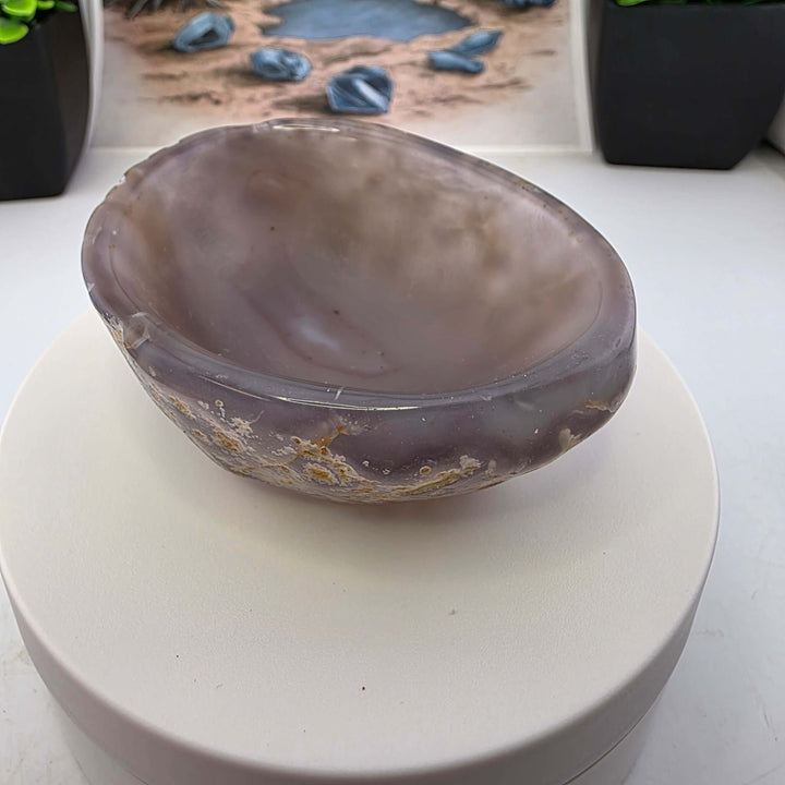 Hand carved Agate Bowl showcasing a smooth interior and rugged exterior, perfect for functional art display.