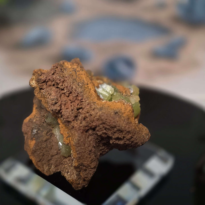 Vibrant Adamite Specimen from Ojuéla Mine exhibiting glowing green crystal formations.