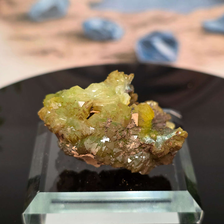 Vibrant Adamite Specimen from Ojuéla Mine exhibiting glowing green crystal formations.