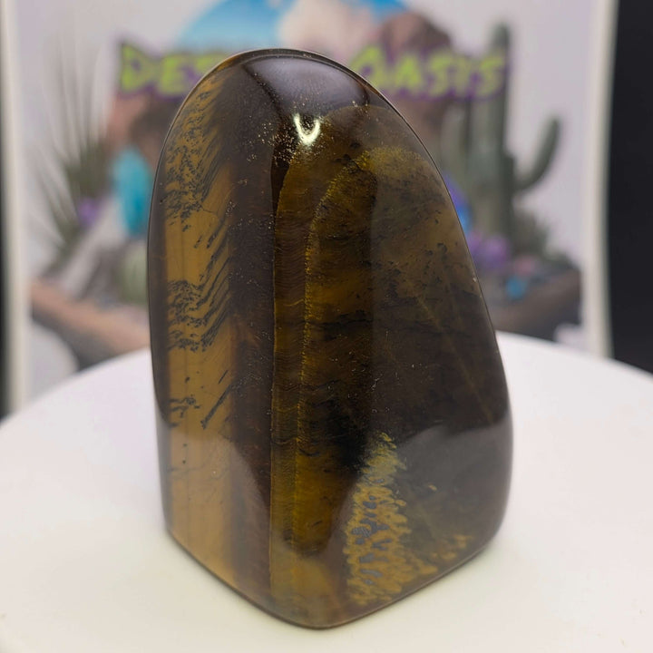 Polished Tiger's Eye freeform displaying golden hues and chatoyancy, perfect for crystal enthusiasts and collectors.