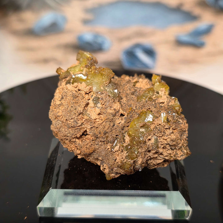 Vibrant Adamite Specimen from Ojuéla Mine exhibiting glowing green crystal formations.