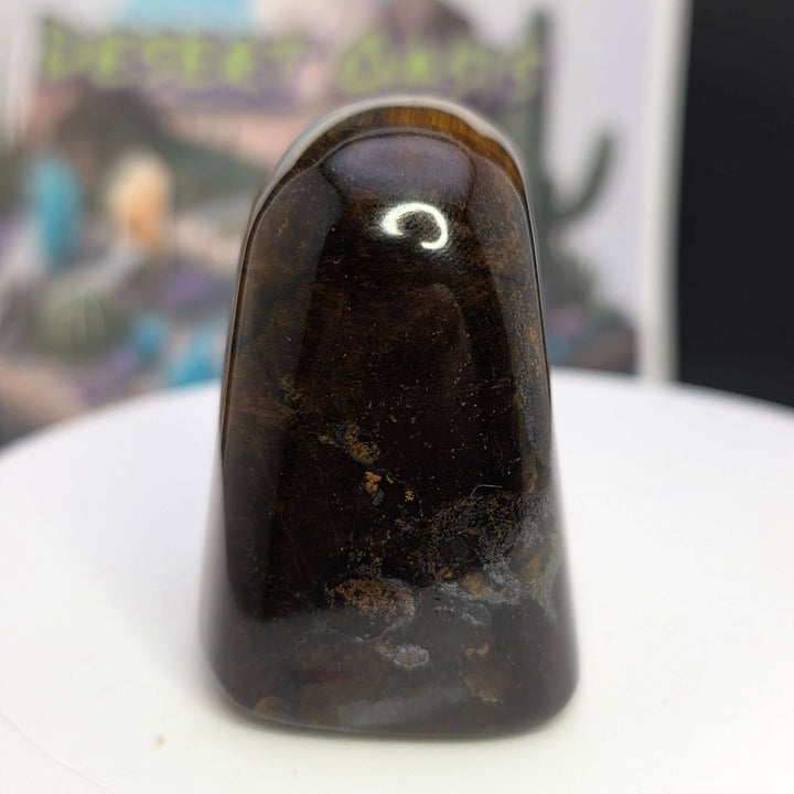 Polished Tiger's Eye freeform showcasing its golden chatoyancy and smooth surface, perfect for decor or meditation.