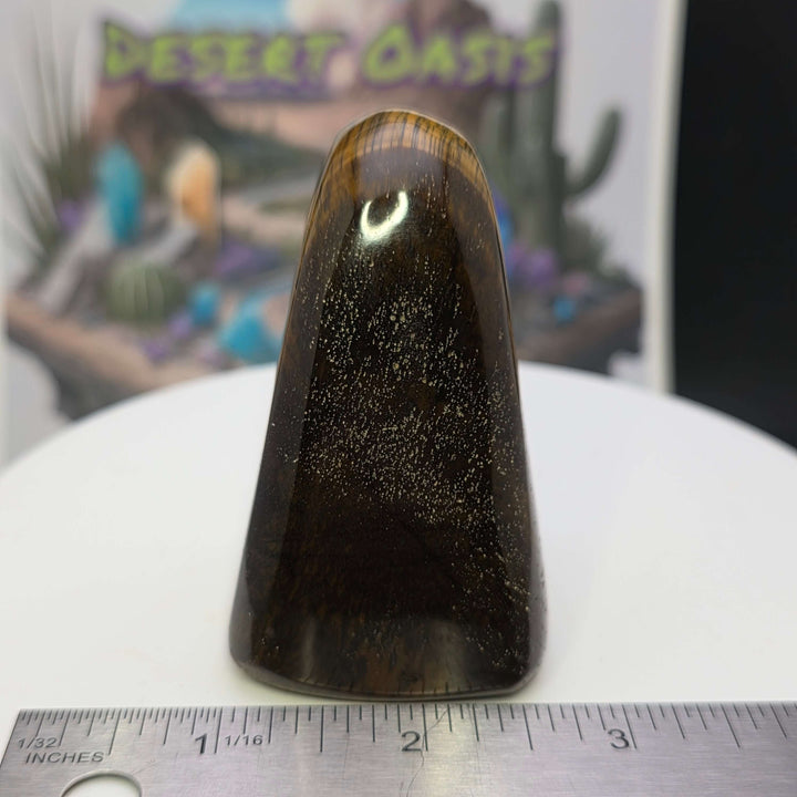 Polished Tiger's Eye freeform showcasing golden chatoyancy, smooth surface, and unique shimmer.
