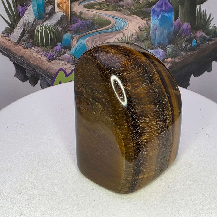 Polished Tiger's Eye freeform with golden chatoyancy, showcasing its striking shimmer and unique shape.